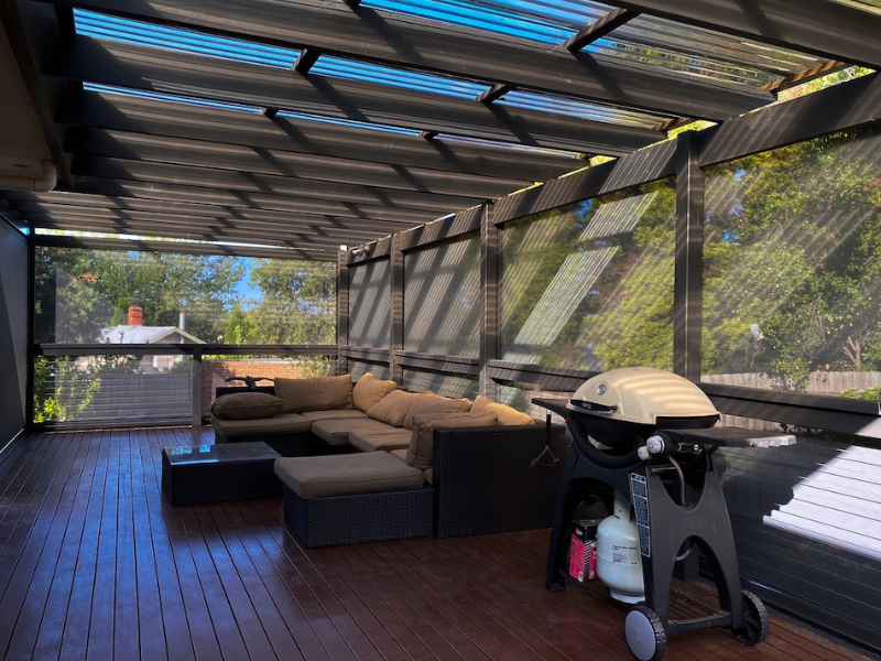 Folding-arm awning providing shade over a Melbourne alfresco